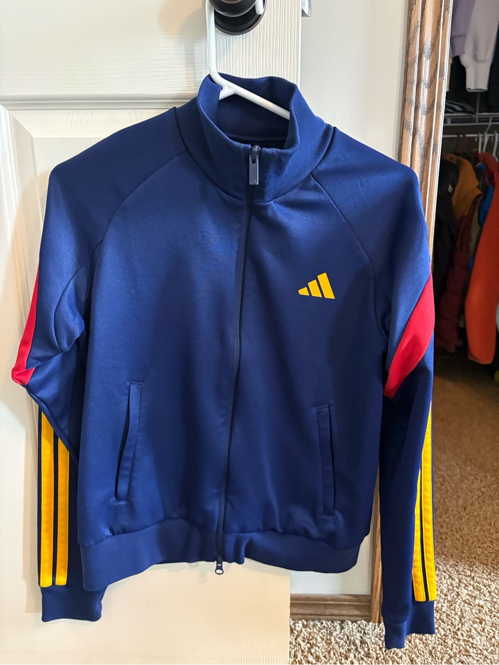 Adidas women’s Navy Jacket with Yellow Logo and Red Sleeve Accents